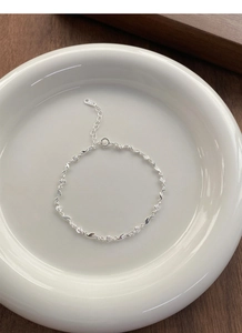 Detailed close-up of S925 sterling silver rose bracelet with delicate floral links