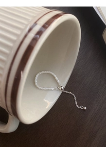 Detailed view of adjustable S925 sterling silver chain ring with a shimmering texture