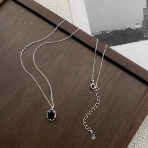 Minimalist 925 sterling silver necklace with oval black zircon pendant in jewelry tray