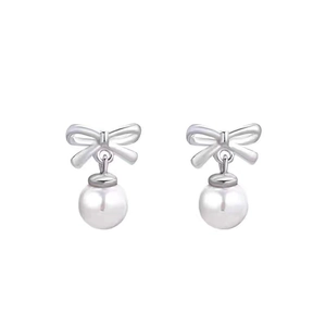 Elegant S999 sterling silver bow earrings with round white pearls on a white background