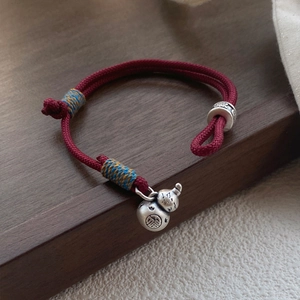 Handmade red cord bracelet with silver gourd pendant and auspicious Chinese engravings