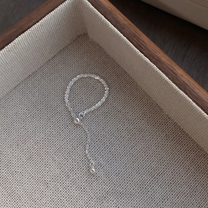 Minimalist S925 sterling silver beaded chain ring with adjustable ball on a jewelry box