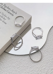 Detailed macro view of S925 sterling silver ring showing the marquise-cut crystal and hallmark