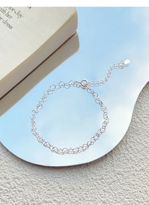 Close-up of S925 sterling silver heart chain bracelet with adjustable lobster clasp detail