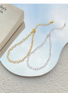 Detailed view of S925 sterling silver heart chain bracelets in gold and silver finishes