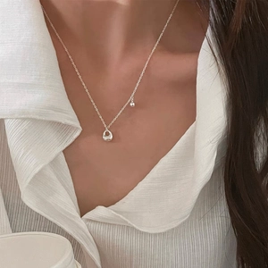 Minimalist S925 sterling silver necklace with double oval and ball pendant on model