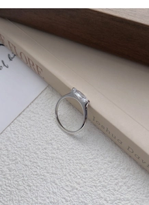 Macro shot of S925 sterling silver ring showing the inner S925 hallmark and marquise cut diamond