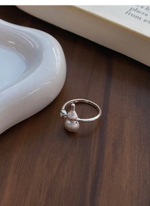 Macro detail of S925 sterling silver frosted gourd ring with a clear zircon stone