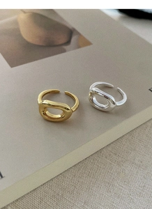 Detailed macro view of S925 sterling silver hollow oval rings in gold and silver finishes