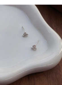 Detailed view of S999 sterling silver geometric triangle earrings with cubic zirconia