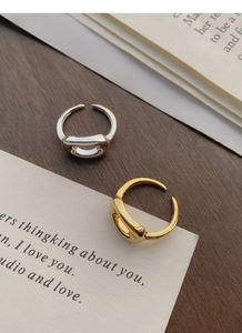 Detailed close-up of S925 sterling silver minimalist oval open ring with engraved hallmark