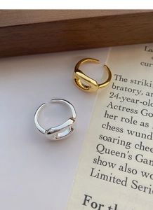 Detailed macro view of S925 sterling silver stamp on minimalist open geometric rings