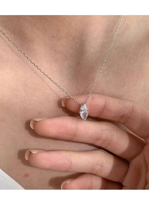Close-up of a marquise-cut diamond necklace in S925 sterling silver worn by a model