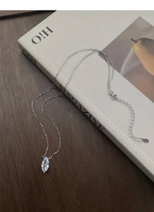 Detailed view of S925 sterling silver marquise cut zircon necklace on a lifestyle background