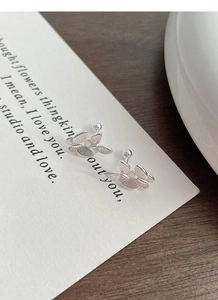 Detailed close-up of S999 sterling silver butterfly stud earrings with screw-on ball back