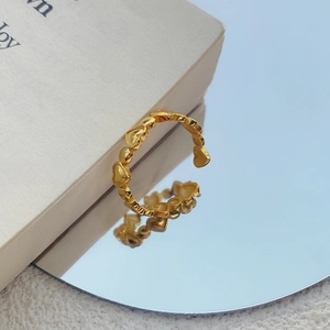 Elegant adjustable S925 silver gold heart ring showcased on a reflective mirror surface