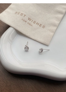 Detail of S999 silver snake stud earrings with zircon in a premium gift packaging setting