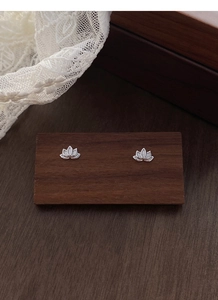 Detailed macro view of S999 sterling silver lotus stud earrings with layered petals