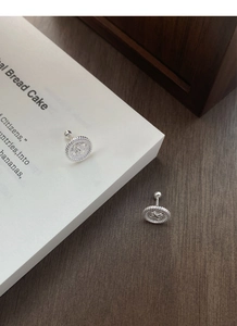 Detailed view of S999 sterling silver coin stud earrings with secure screw ball back closures