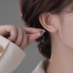 Elegant S999 sterling silver heart stud earrings with sparkling zircon stones