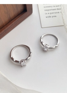 Detail shot of two S925 sterling silver ballet rings with sparkling round zircon stones
