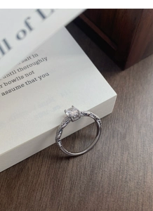 Close-up of S925 silver ring with twist band and round brilliant cubic zirconia stone