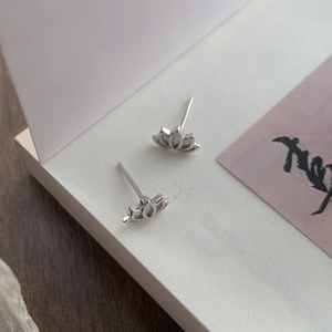 Minimalist S999 sterling silver lotus stud earrings with delicate hollow petals design