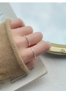 Detailed close-up of S999 sterling silver bamboo joint rings worn on fingers with a vintage vibe