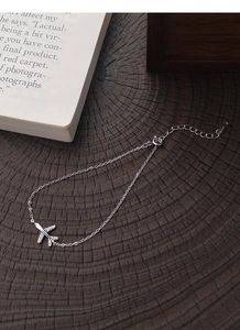 Detailed view of S999 silver airplane bracelet with sparkling zircon stones