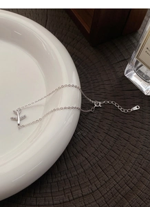 Detail of S925 silver airplane bracelet with sparkling zircon stones and adjustable chain