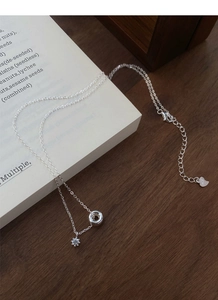 Close-up of S925 sterling silver chain with a hexagram star pendant and heart tag