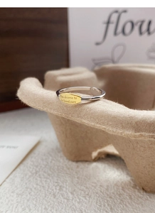 Detail of S925 silver ring featuring an oval gold plate with inspirational engraving