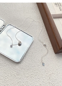 Detail view of S925 sterling silver chain with zircon pendant and S925 heart hallmark tag