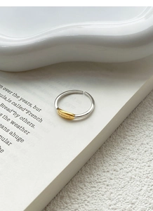 Macro detail of S925 silver ring featuring a gold plate with inspirational engraving