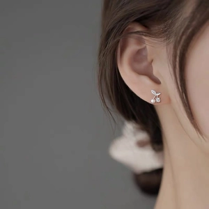 S999 Sterling Silver Cherry Pearl Stud Earrings worn by a model with a minimalist style