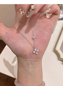 Detailed view of S925 sterling silver four-leaf clover necklace with micro-pave zircons