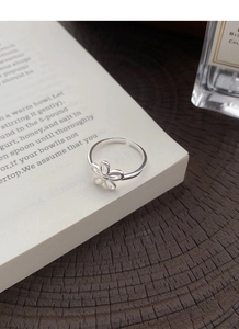 Close-up of S925 sterling silver hollow flower ring showing the hallmark on the band