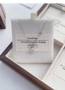 Close-up of S925 sterling silver clover necklace with sparkling cubic zirconia stones