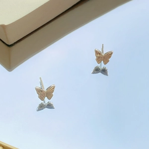 Boucles d'oreilles papillon en argent S999 avec texture fine et reflet miroir