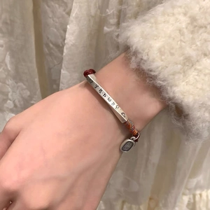 Minimalist S999 silver red string bracelet with engraved mantra for women on hand