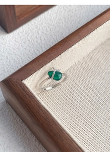 Detail of S925 silver ring featuring green chalcedony gourd with diamond bow accents