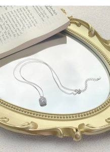 Detail of S999 silver sugar cube necklace with a square zircon pendant and box chain