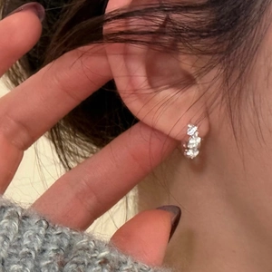 Elegant S925 sterling silver flower hoop earrings with twisted design and cubic zirconia pavé