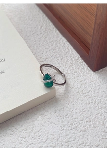 Detail of S925 silver ring featuring a green chalcedony gourd with diamond accents