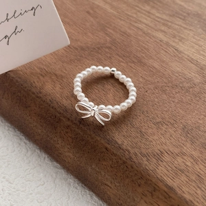 Elegant S925 sterling silver pearl bow ring featuring elastic beaded design for women