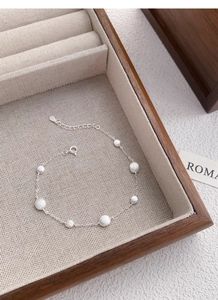 Detail of S925 silver beaded bracelet with matte round beads and adjustable lobster clasp