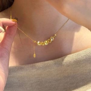 S925 Sterling Silver Five Emperors Coin necklace with golden finish on a female model