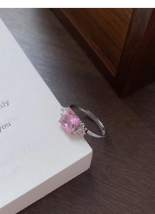 Macro shot of princess cut pink zircon stone set in adjustable S925 silver ring band