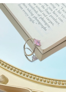 Macro view of a square pink zircon gemstone set in a S925 silver four-prong ring
