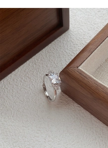 Macro shot of silver S925 adjustable ring with large rectangular zircon gemstone
